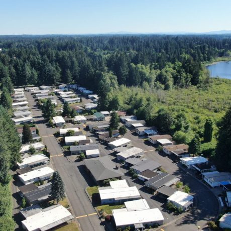 aereal view of homes and lake in Western Plaza